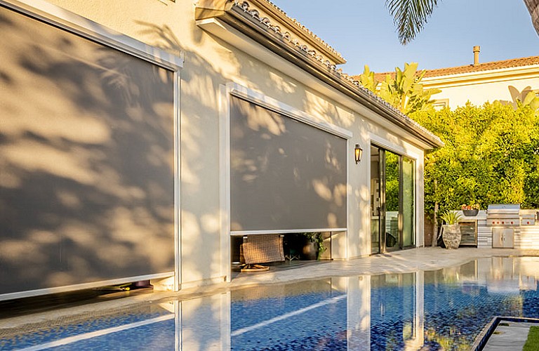 Storm and solar rolling screens for hurricane protection and sun control, direct wholesale supplier for homes and businesses.